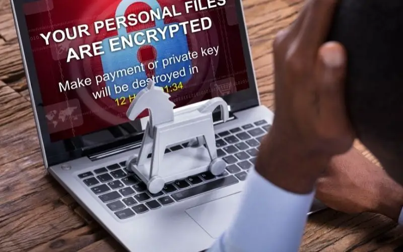 Worried businessman encrypted text on the laptop